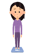 体重計に乗ったやせ過ぎの女性